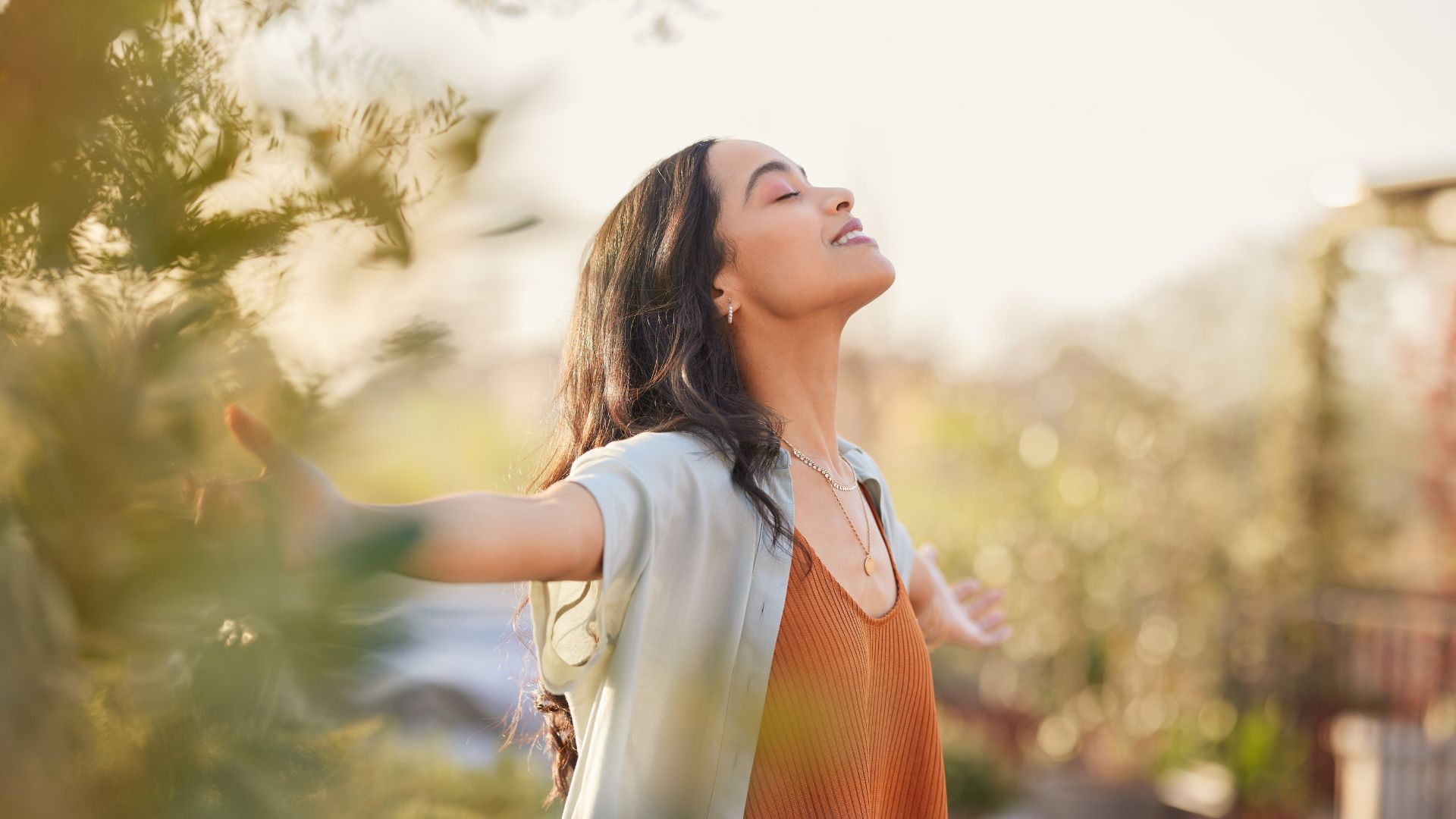 woman smiling at the sky
